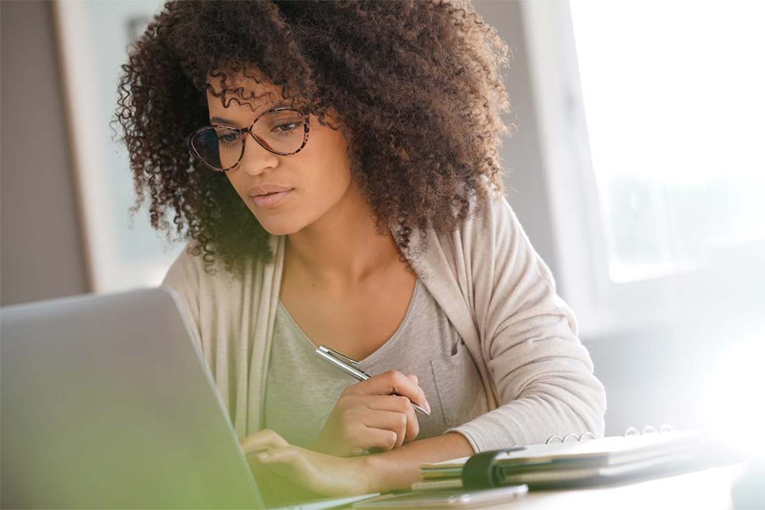 Woman working in front of laptop